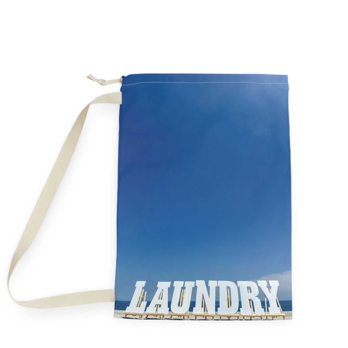 Laundry bag with shoulder strap and drawstring. Allover same print on both sides. "28 x "36. "Shoreline Laundry Day".