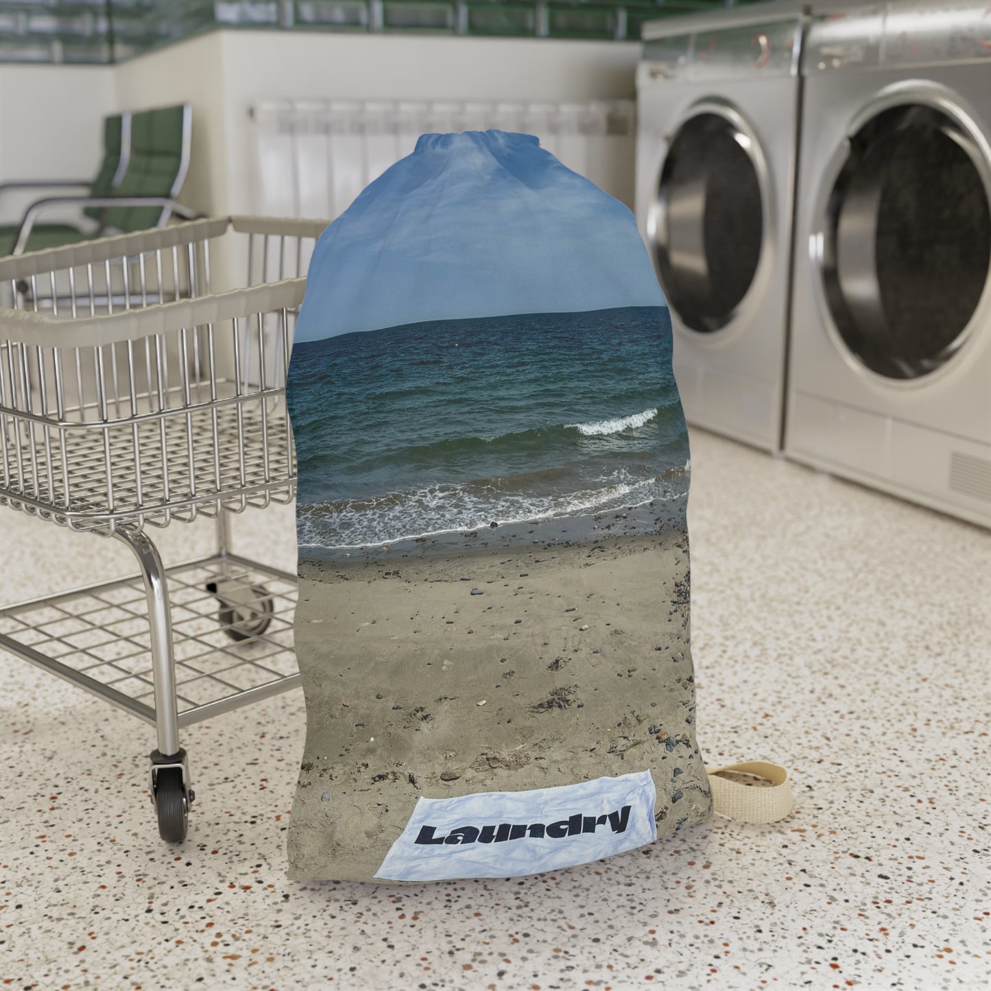 Laundry bag with shoulder strap and drawstring. Allover same print on both sides. "28 x "36. "Seaside Laundry Day".