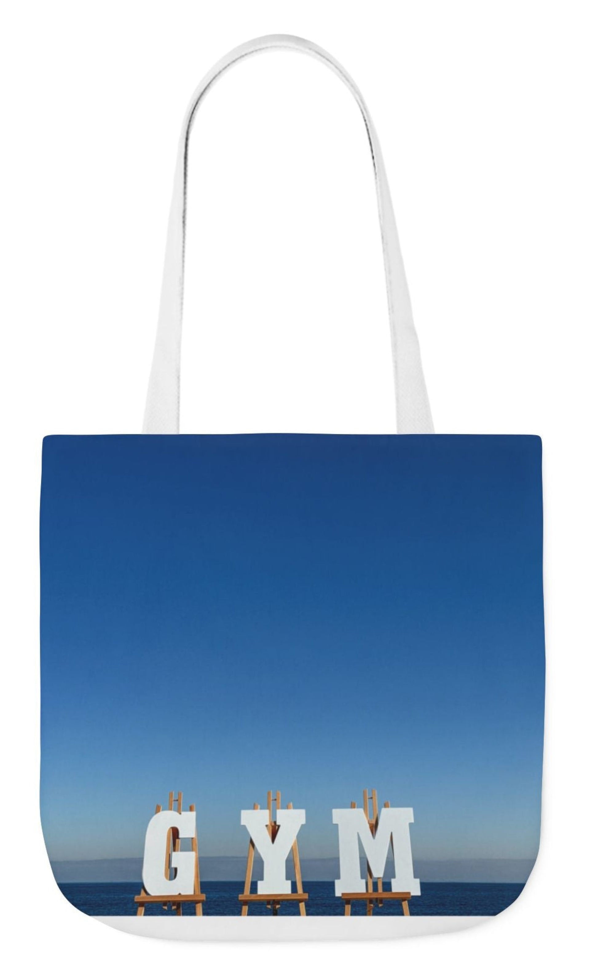 gym tote bag white gym letters against blue sea and sky 18 x 18