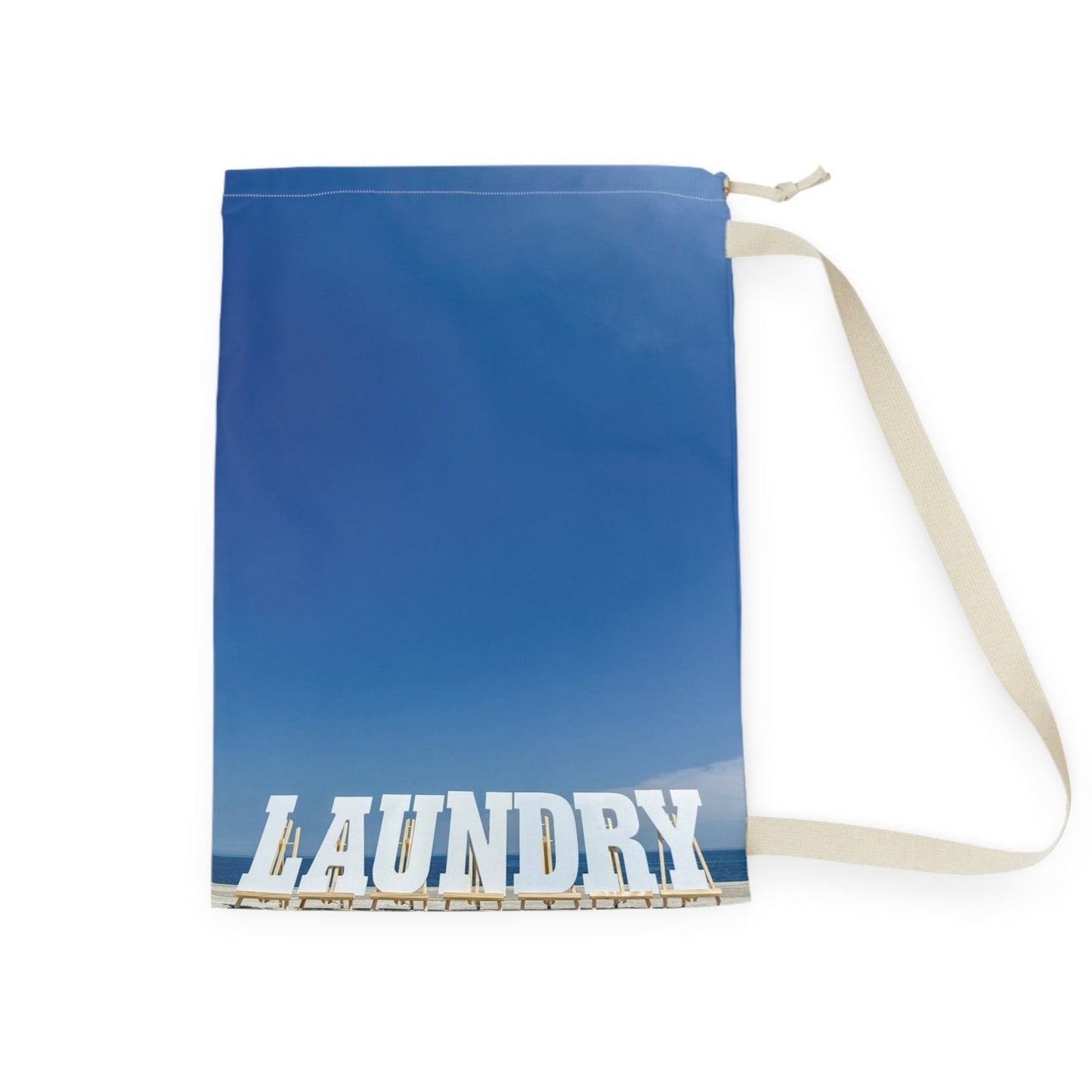 Laundry bag with shoulder strap and drawstring. Allover same print on both sides. "28 x "36. "Shoreline Laundry Day".